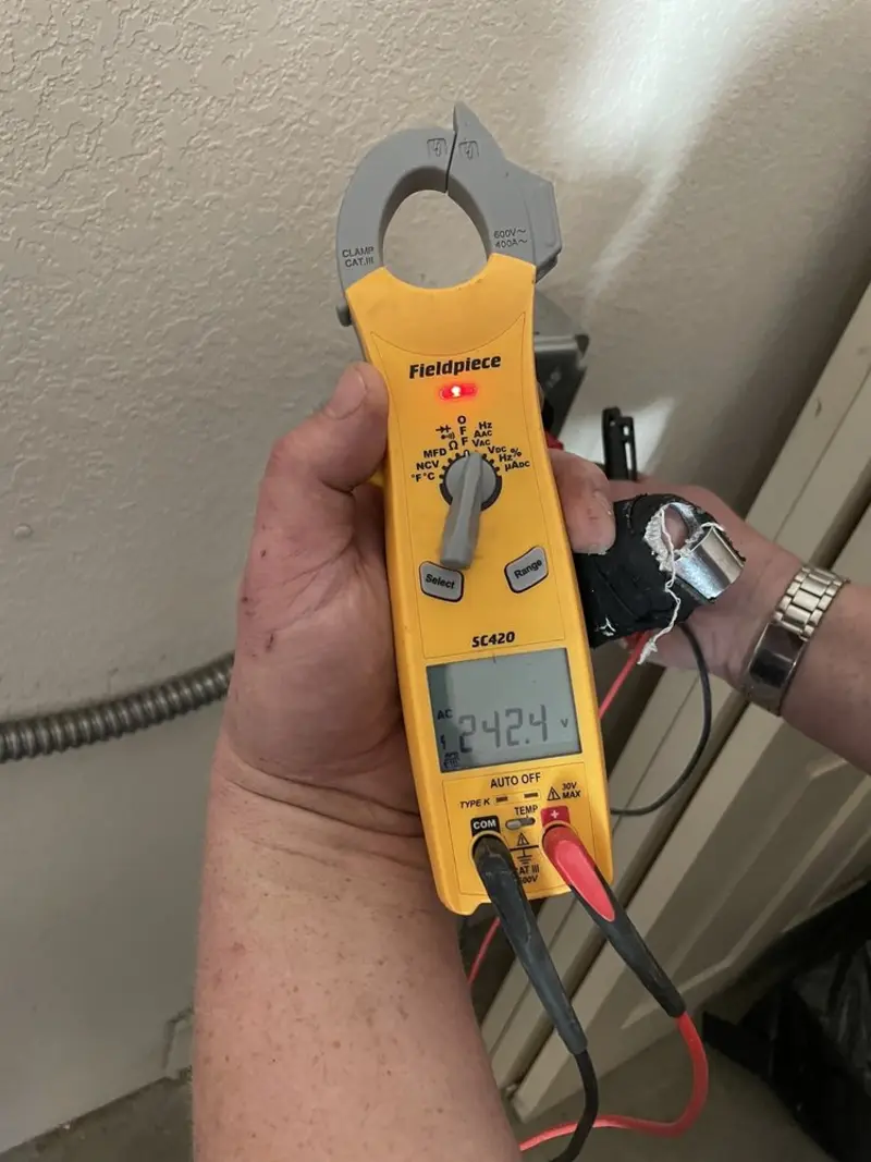 Voltage testing with clamp meter during Electrical Installation Services in Carl Junction
